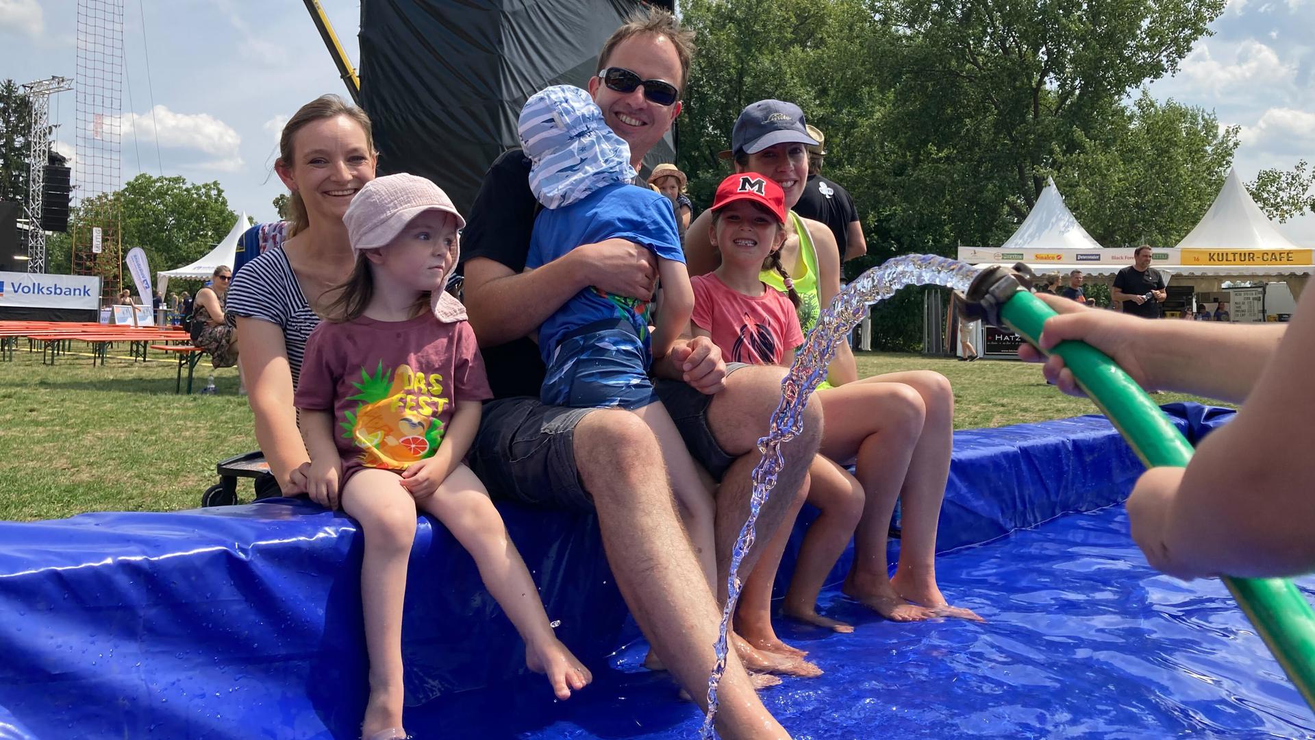 Feet in the water: The Wonneberger family cools off in the pool at the Mobi exhibition area. 