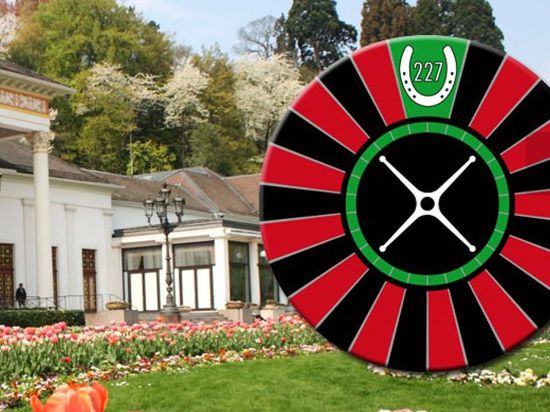 Roulette und Hufeisen: Das Logo des Round Table 227 Baden-Baden, hier vor der Kulisse des Kurhauses, bezieht sich bewusst aufs Baden-Badener Casino und die Galopprennbahn in Iffezheim.