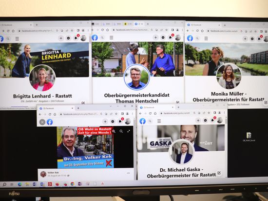 Blick auf einen Computerbildschirm, auf dem fünf Fenster geöffnet sind, die die Facebook-Accounts der Rastatter OB-Kandidaten zeigen.