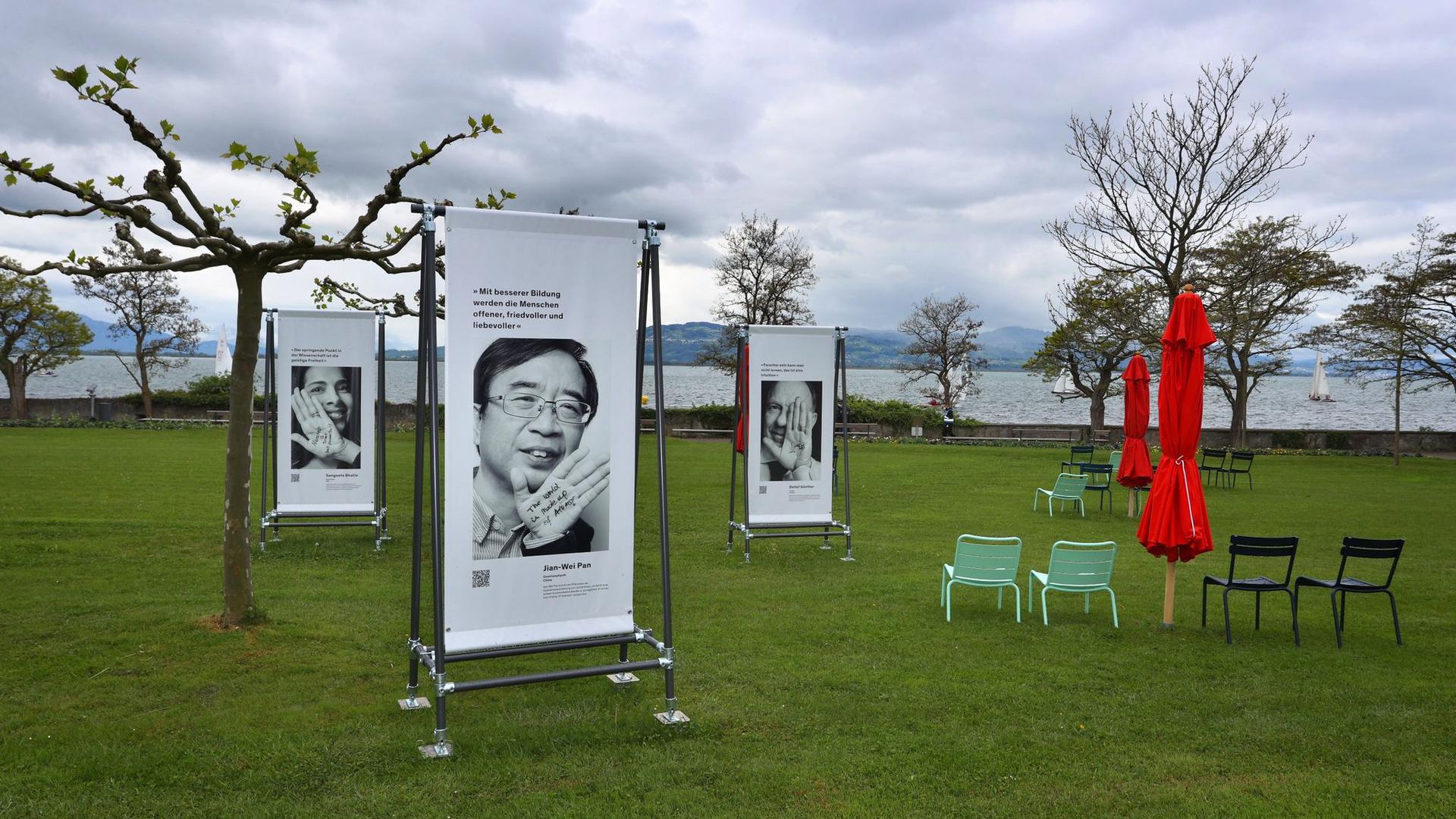 Portraits von Wissenschaftlern aus der ganzen Welt sind am Ufer des Bodensees ausgestellt.