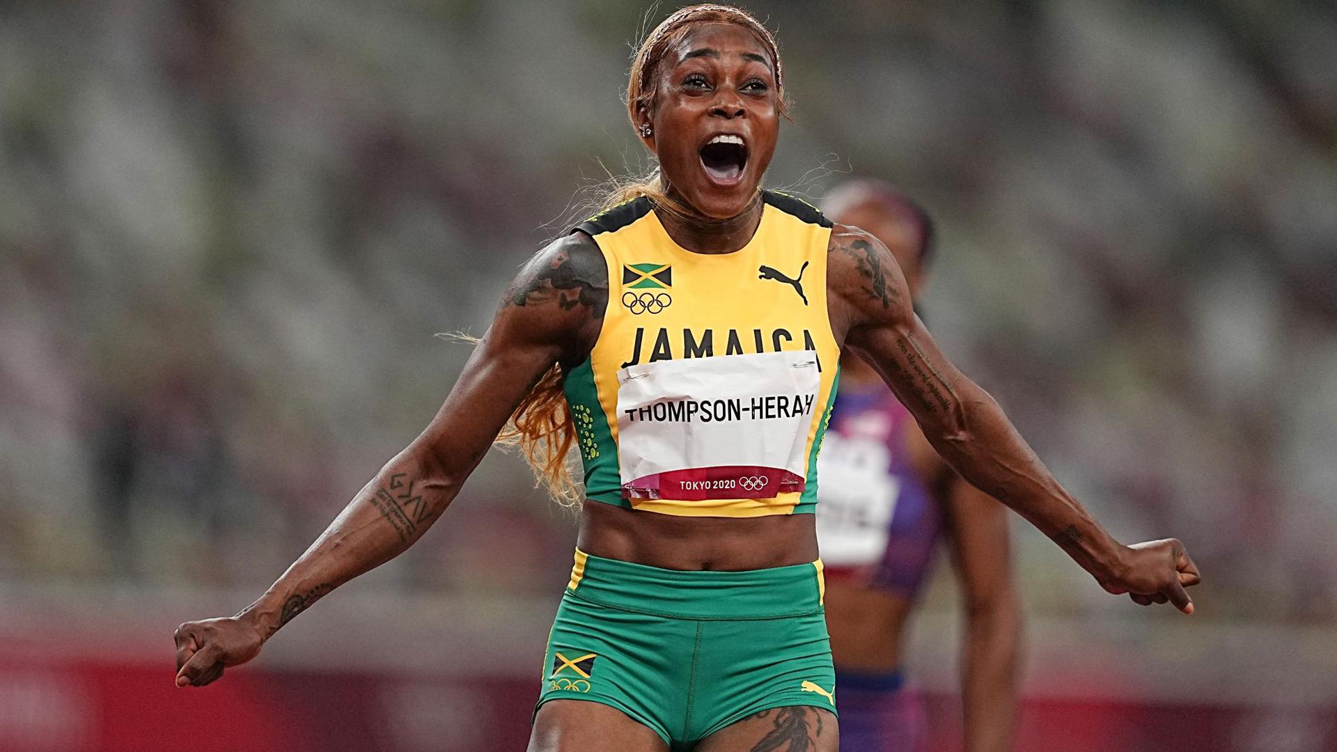 Jamaikas Elaine Thompson-Herah feiert olympisches Gold über 100 Meter.
