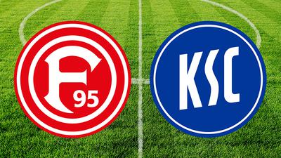 Fortuna Düsseldorf Logo und KSC Logo vor dem Fußballplatz